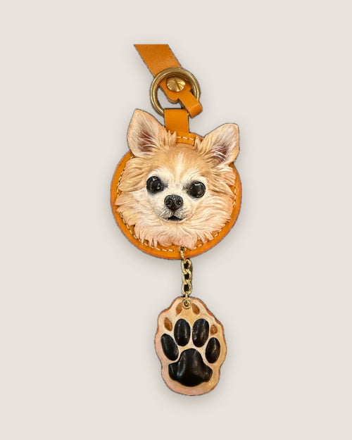 Round chihuahua keychain with a matching paw charm